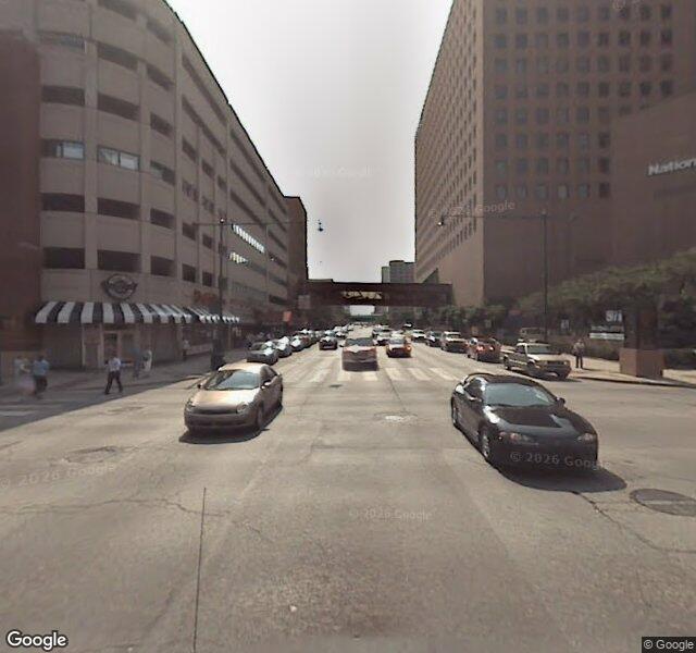 Sample street scene with buildings, traffic, and a pedestrian bridge